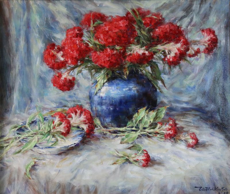 Red cockscomb flowers in blue jar. Aug. 2019